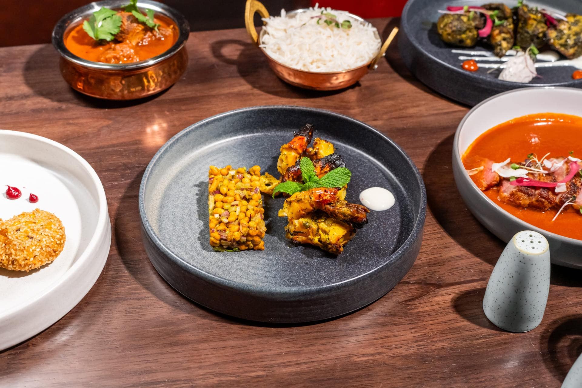 Courses set out across the table at Holi
